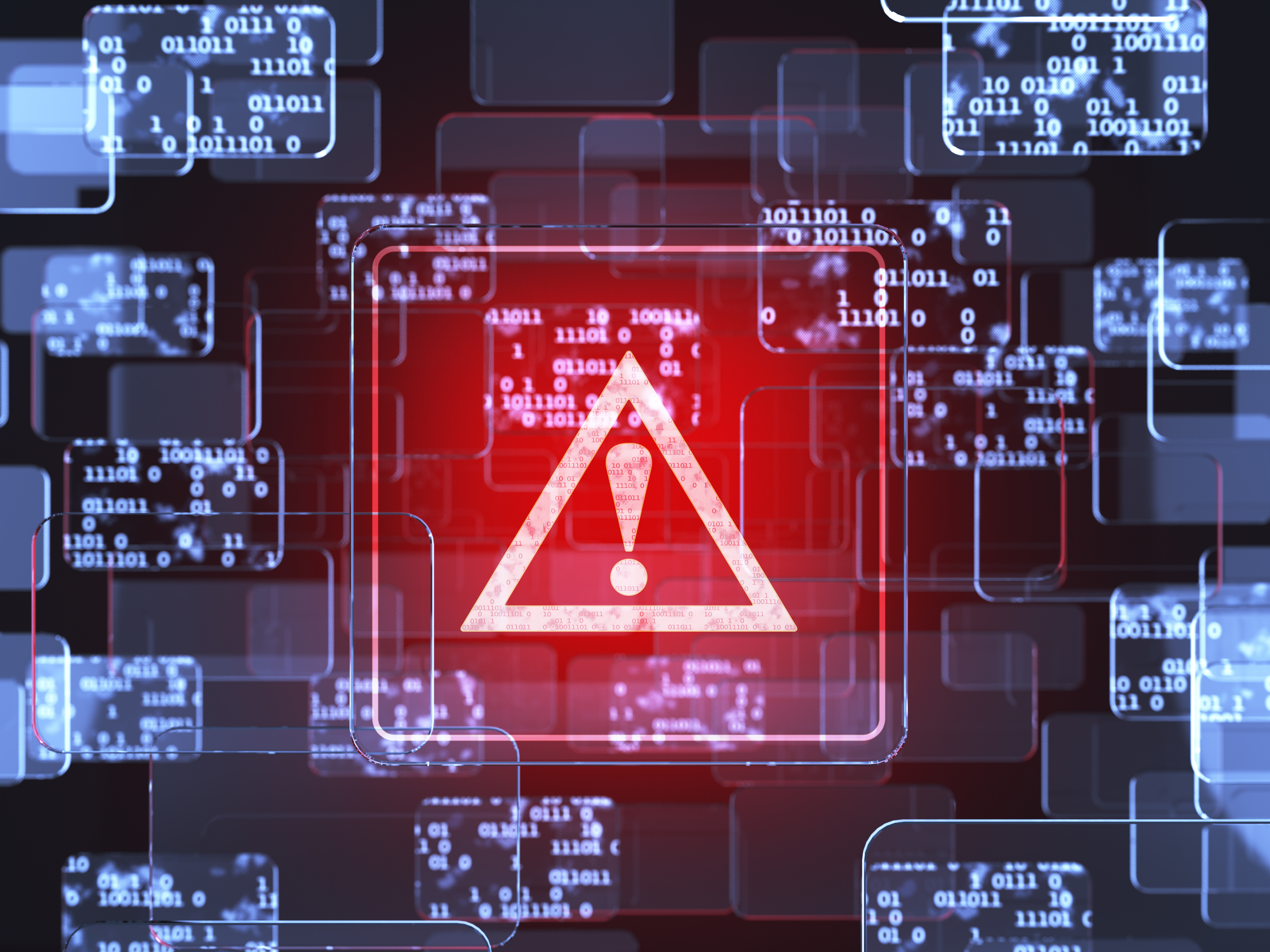 A red cybersecurity warning alert icon is shown over a blue background of screens filled with ones and zeroes.